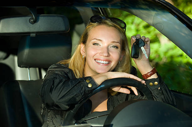 istock Young woman with keys from car 153711384