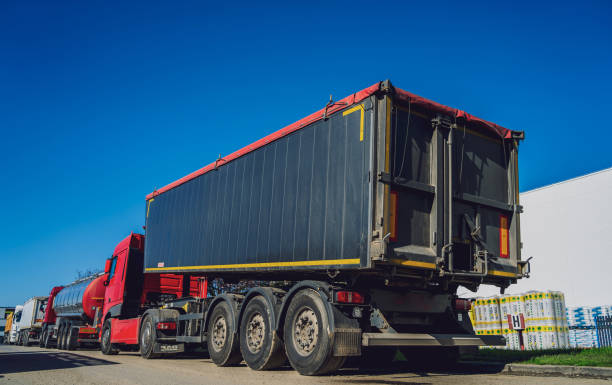 istock Cargo trucks along the road at the blue sky background 1537114595