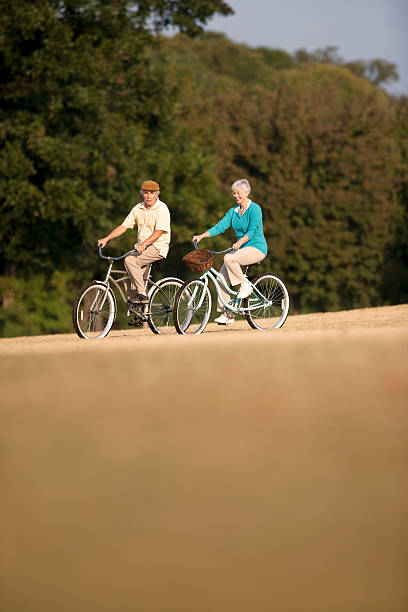 istock Senior Couple Biking 153711485