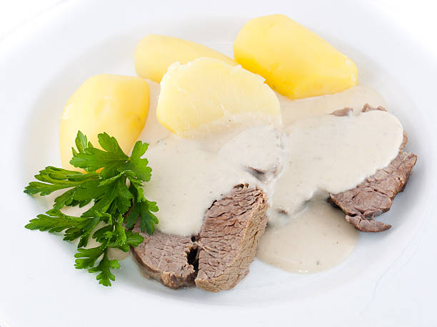 istock meat with sauce and potatoes 153711566