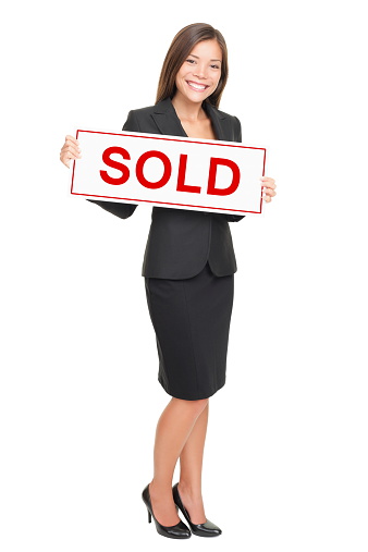 Real estate agent showing sold sign isolated on white background. Beautiful smiling Asian / Caucasian female Real Estate Agent standing confident in full length.Click for more:
