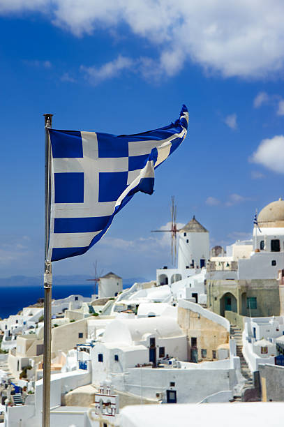 istock Greece flag on Oia background at Santorini island 153712205