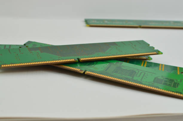 Close-up of a high-capacity RAM memory for a computer, highlighting the importance of technology in expanding storage capacity. Close-up of a high-capacity RAM memory for a computer, highlighting the importance of technology in expanding storage capacity. motherboard ram slots stock pictures, royalty-free photos & images