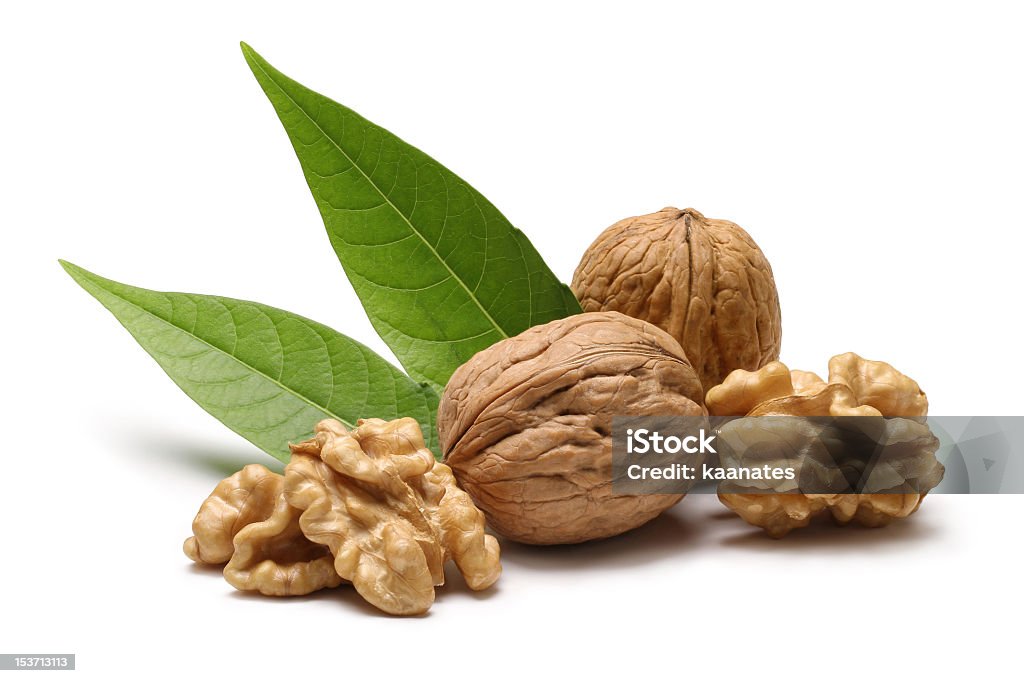 Walnuts with leaves isolated on white background Walnut on a white background Walnut Stock Photo