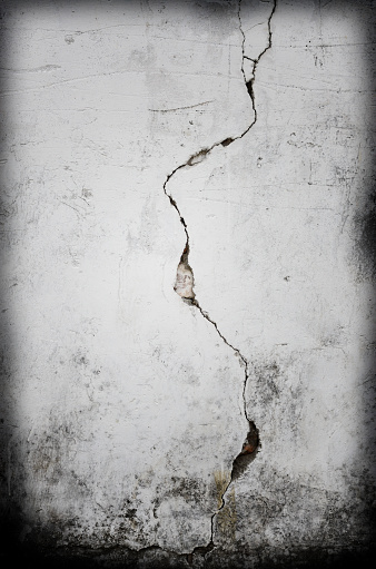 Cracks on grunge wall backgrounds.