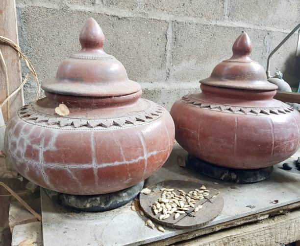istock teapots are sitting on a table with a wooden spoon and a bowl. 1537134382