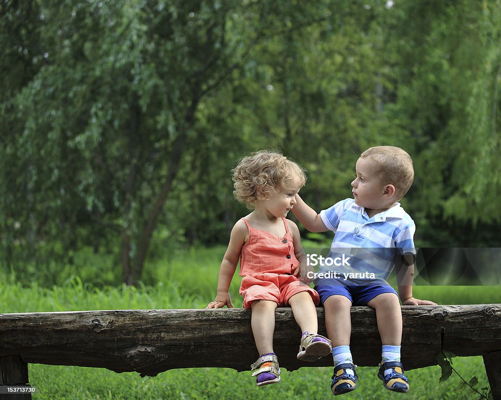 Kind words Children in summer park. Please, see more summer photos in my lightbox Bench Stock Photo