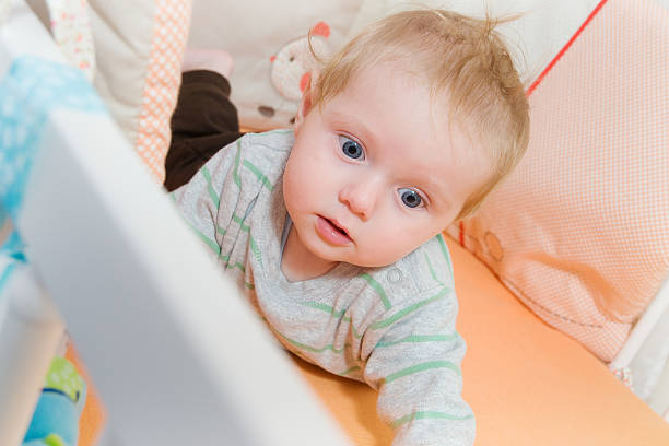 istock baby in the crib 153713796