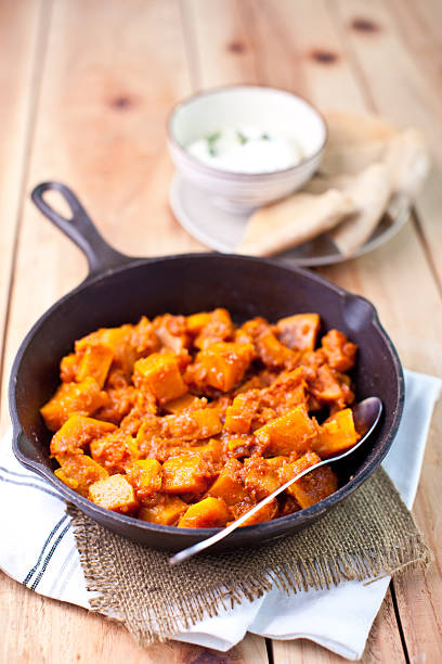 istock Fried pumpkin with  tomato sauce in cast-iron pan 153714154