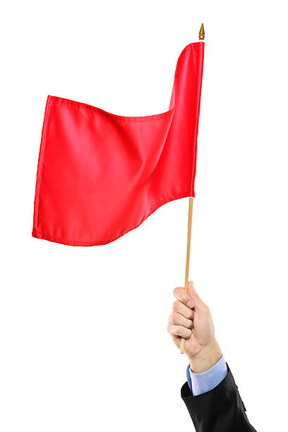 istock A hand waving a red flag on a white background 153714873