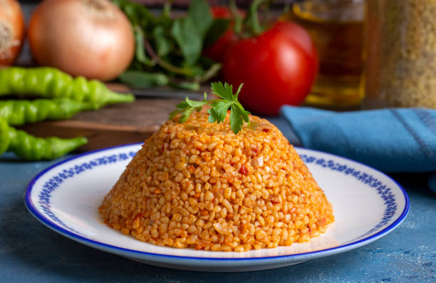 istock Traditional turkish bulgur pilaf with tomato sause in plate (Turkish name; meyhane pilavi) 1537149555