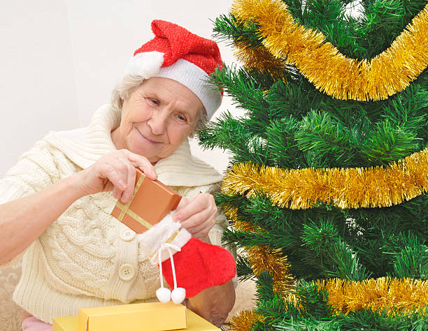 Granny With Christmas Stocking Stock Photo - Download Image Now -  Grandmother, Christmas, Christmas Stocking - iStock