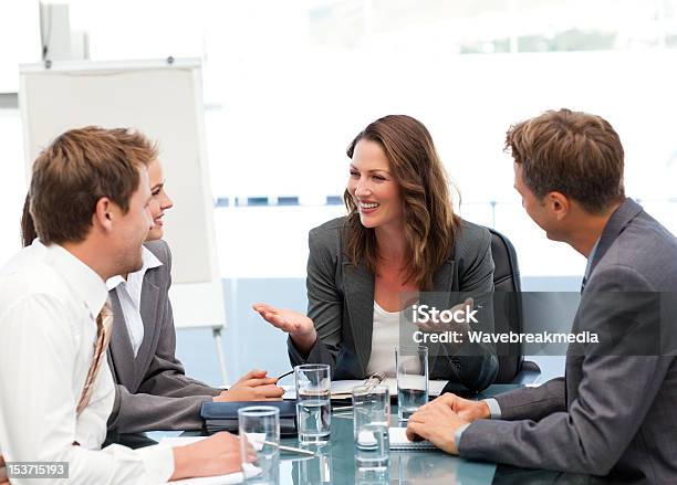 Attractive Businesswoman Laughing With Her Team Stock Photo - Download Image Now - 30-34 Years, 30-39 Years, Adult