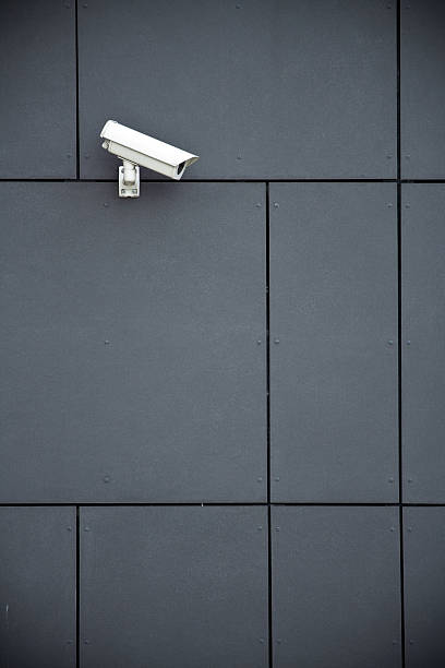 istock Security camera on a wall of grey tiles 153715502