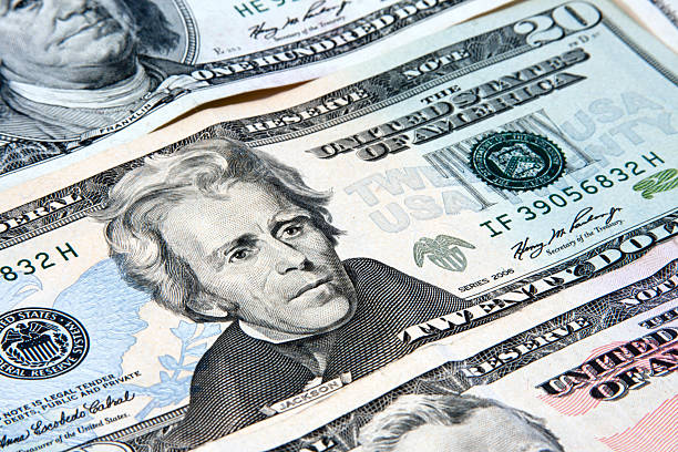 US currency with presidents facing