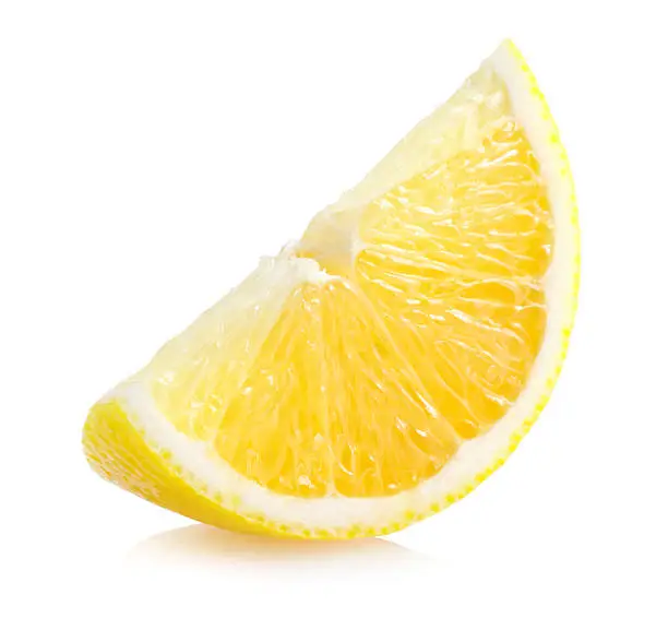 Photo of Slice of lemon isolated on white background