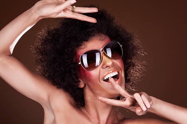 istock dancing girl with afro hair 153715806