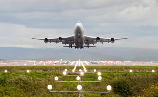 airplane take off at manchester airport, england, uk.