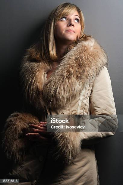 Fashionable Blonde Girl In Fur Coat Stock Photo - Download Image Now - Long Coat, Cold Temperature, Elegance