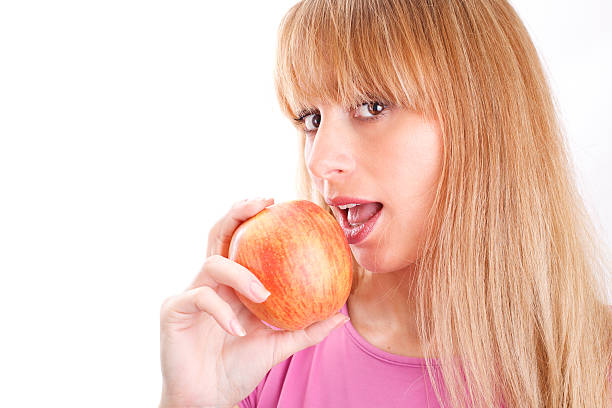 istock Beautiful Woman Eats an Apple 153716803