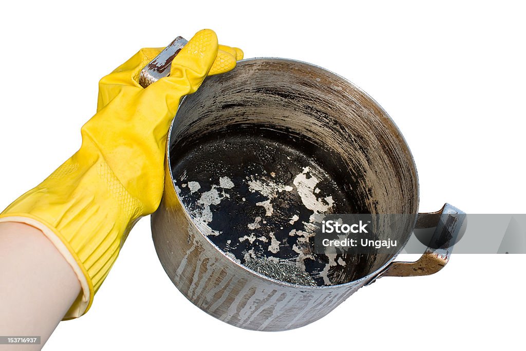 Hand holding pan Hand holding pan isolated on white Burnt Stock Photo