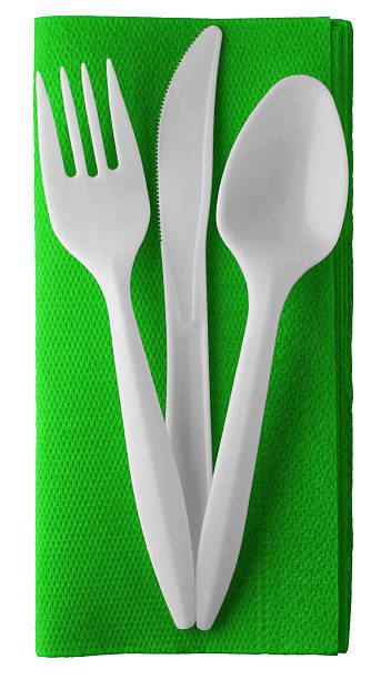 istock Plastic knife fork and spoon on napkin - isolated 153716938