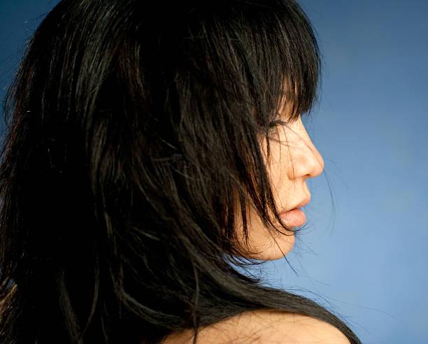 istock beautiful female profile on a blue background 153717015