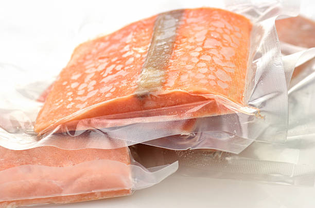 A picture of some pink, bagged salmon