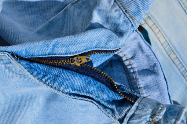 istock Close-up of jeans stitching, highlighting tough and durable lines. Indispensable for projects related to fashion and clothing. Jeans with zipper. 1537171822