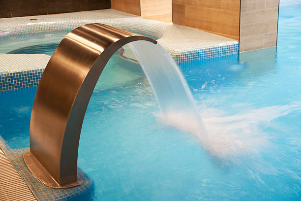 istock waterfall jet and hot tub in action 153717348