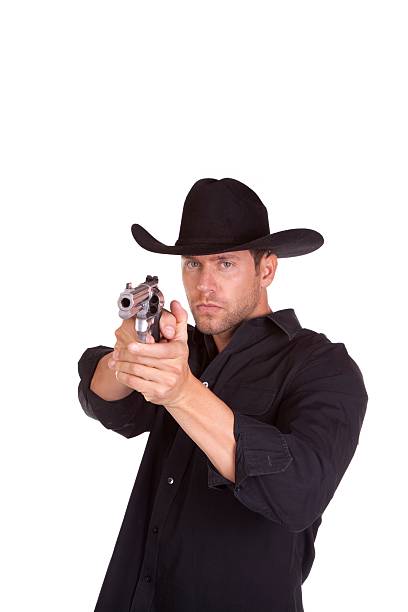 cowboy apuntando pistola - foto de stock