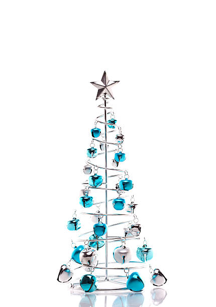 Christmas tree made out of blue and silver jingle bells stock photo