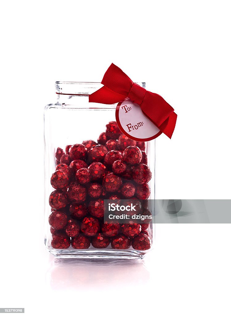 Frasco com vermelho brilhante doce e Etiqueta de Presente - Royalty-free Branco Foto de stock