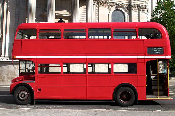 Side view of an empty red Route Master bus in London
