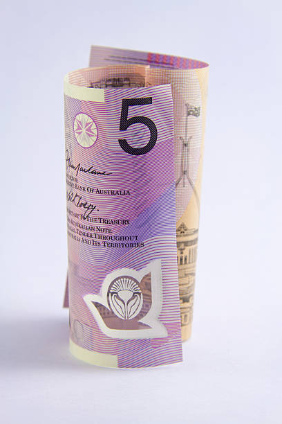 rolled up Australian 5 dollar note stock photo