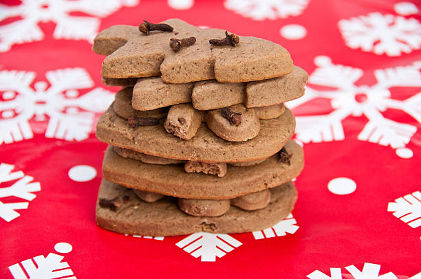 Stack of homemade gingerbread on Christmas paper stock photo