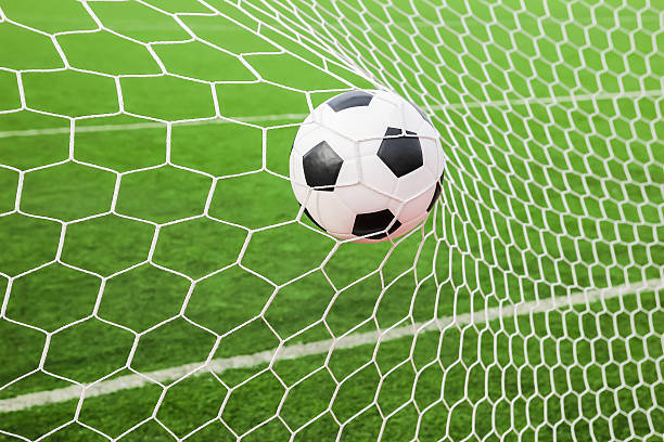 istock soccer ball in the goal net 153722609