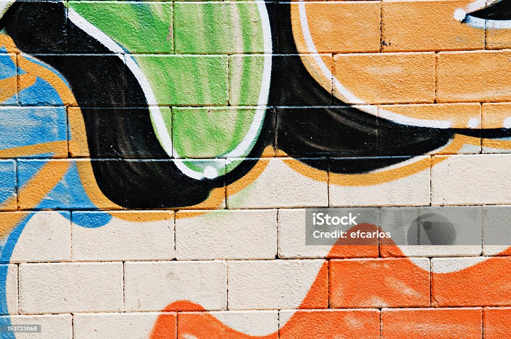 Graffiti on wall Brick wall covered with a graffiti (part of) Mural Stock Photo