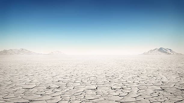 Flat and barren desert away from society desert dry cracked soil stock pictures, royalty-free photos & images