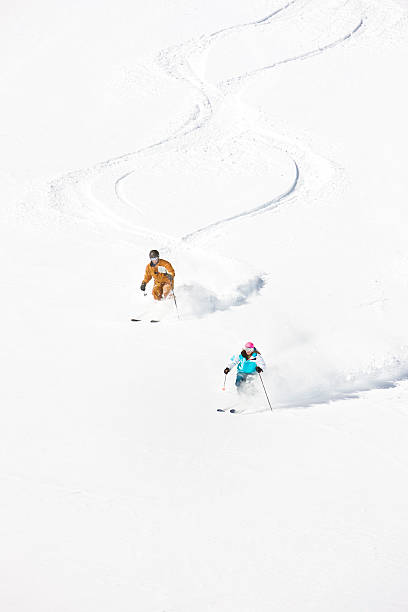 istock Skiers Doing Figure 8 In Powder Snow 153723728