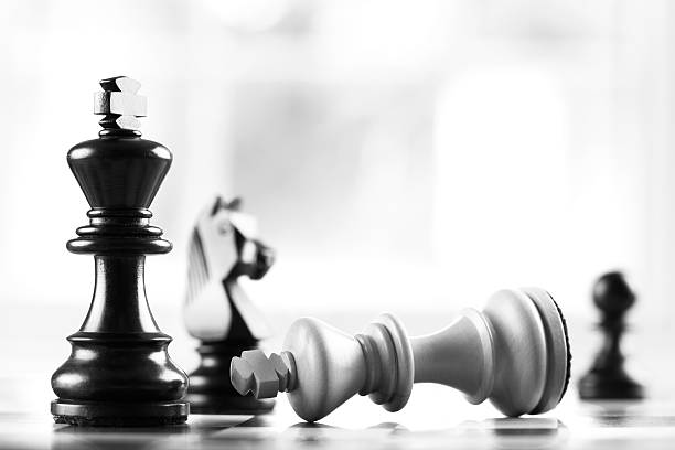checkmate black defeats white king stock photo