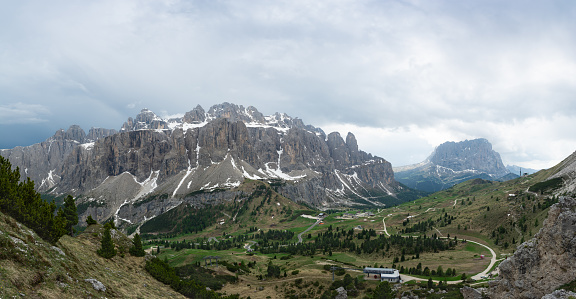 Panoramic view of the Sella group, Gardena Pass and Sassolungo mountain from Pizes de Cir. Dolomites, Italy