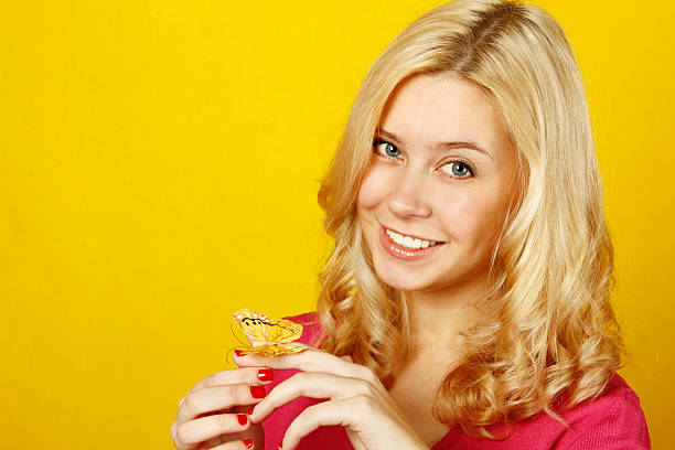 istock Beautiful young woman with a butterfly 153724618