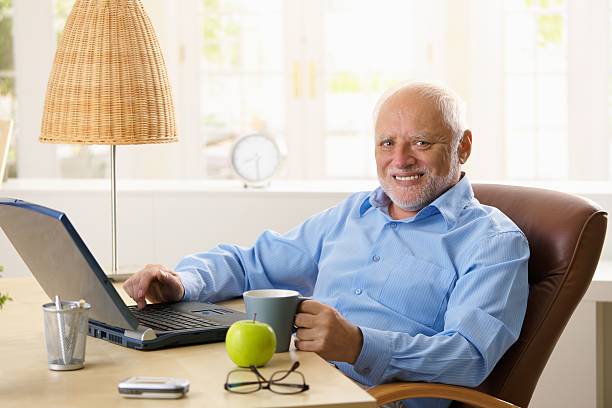 istock Portrait of happy senior man with computer 153725189
