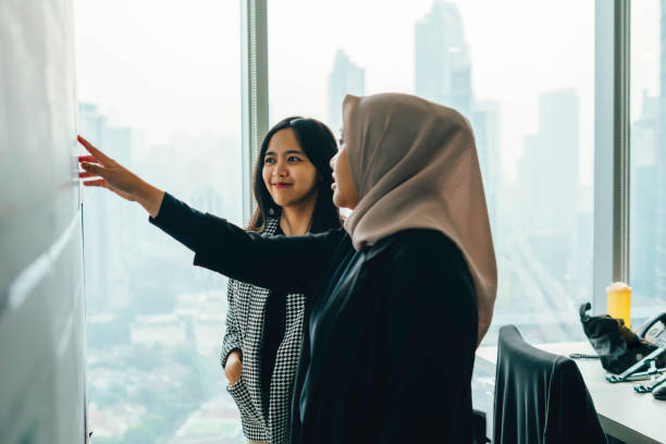 istock Asian people working and discussion on whiteboard in office 1537253132