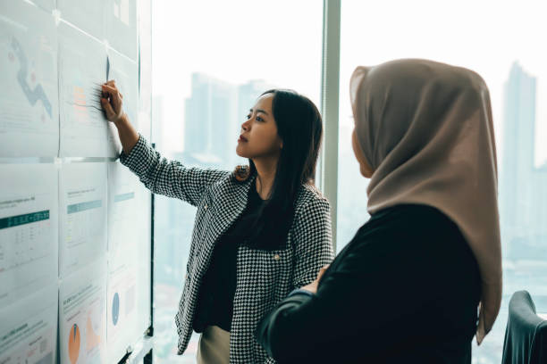 istock Asian people working and discussion on whiteboard in office 1537253619