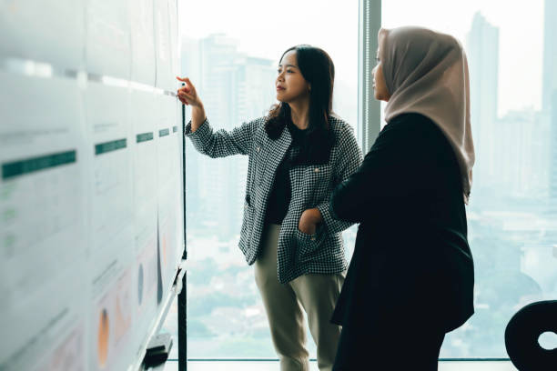 istock Asian people working and discussion on whiteboard in office 1537254688