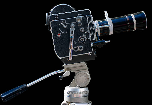 istock Vintage movie camera isolated on black 153725599