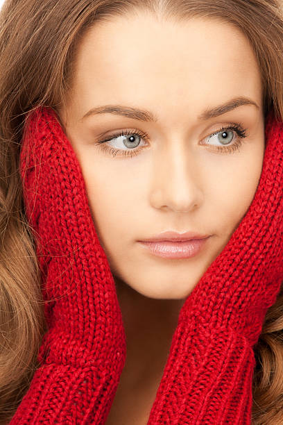 istock beautiful woman in red mittens 153726255