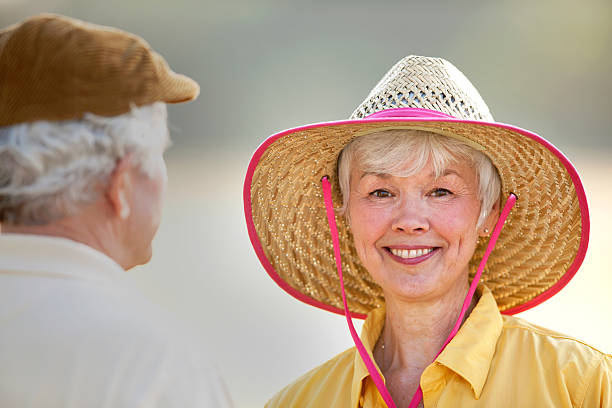 istock Beautiful Senior Lady Wearing Straw Hat 153726271